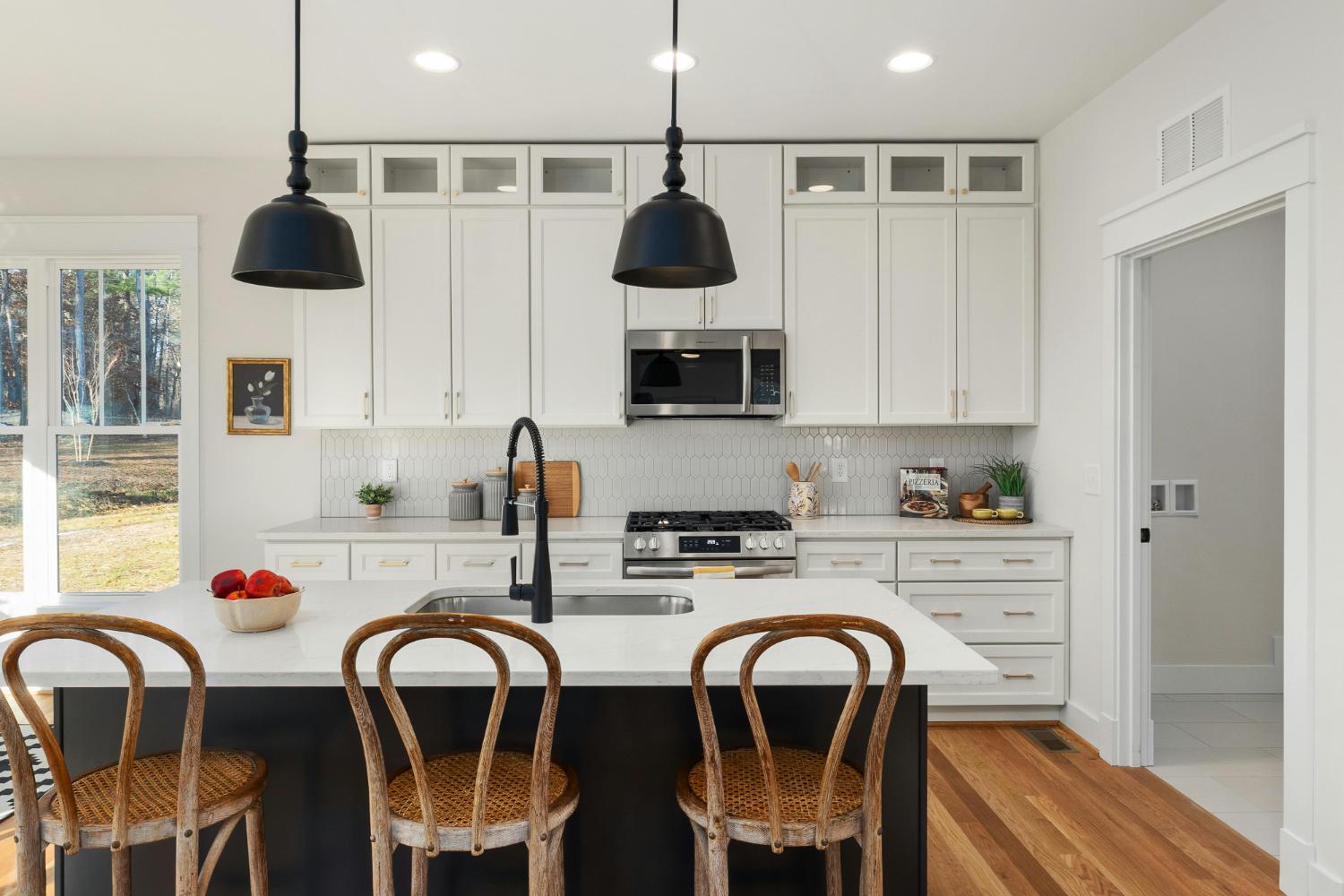 custom kitchen with shaker cabinets and stainless appliances in Troutman NC by Carolina Signature Custom Homes stock-optimized