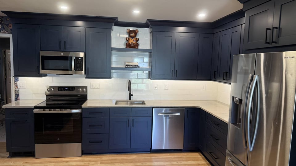 modern kitchen renovation with quartz countertops and subway tile backsplash in Higgins, NC by Carolina Signature Custom Homes