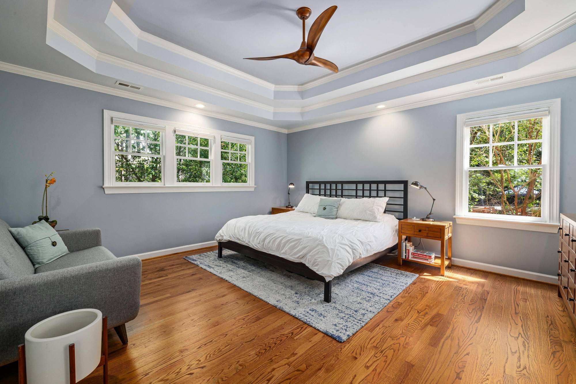 spacious bedroom remodel with large windows and modern furniture by Carolina Signature Custom Homes Troutman NC stock-optimized-optimized