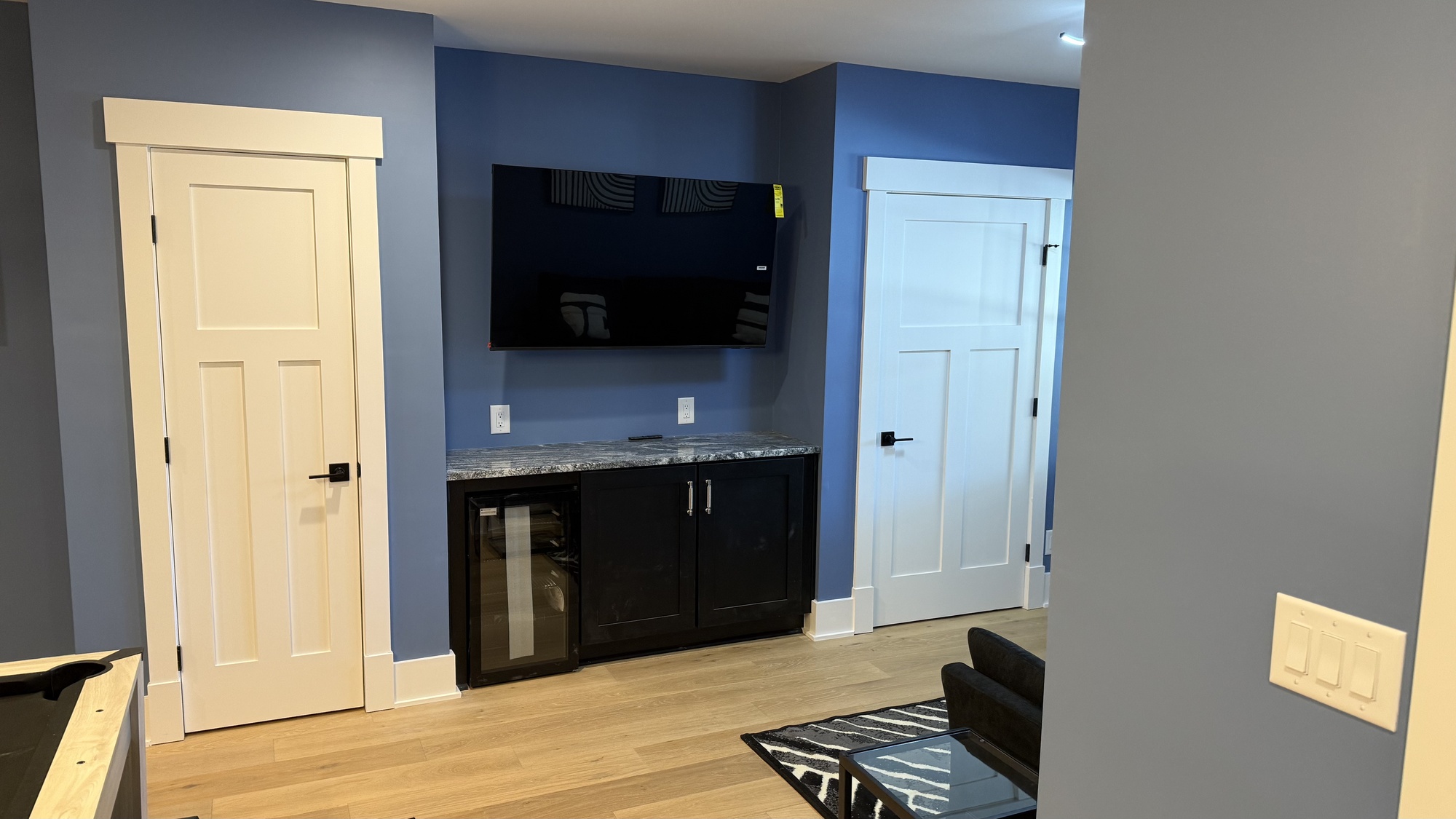 lake norman basement game room a wall mounted tv wet bar and beverage refrigerator