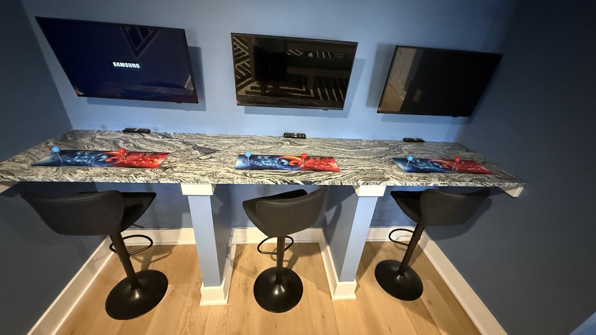 lake norman basement remodel three gaming stations with a granite counter