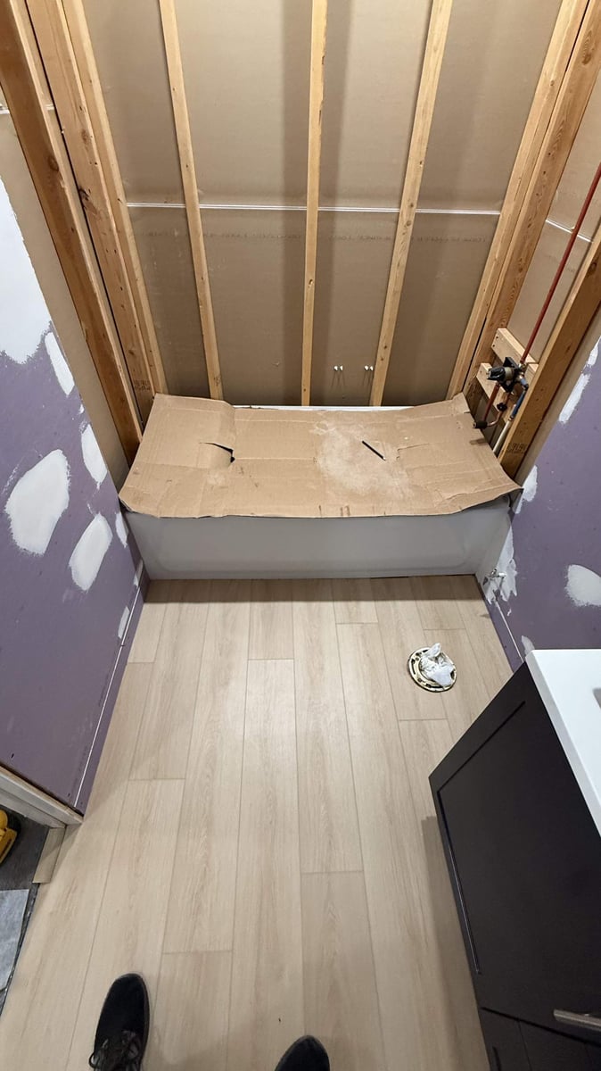 in-progress bathroom renovation with new flooring installation by Carolina Signature Custom Homes in Mooresville, NC-optimized