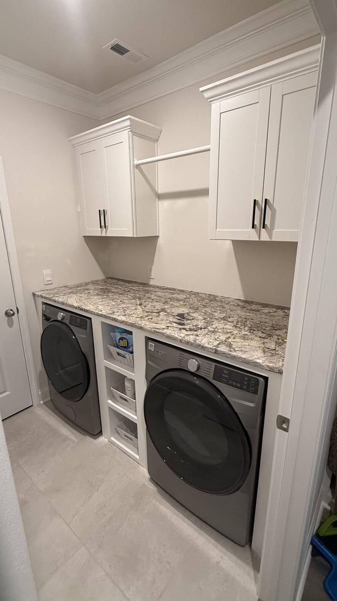 built-in laundry cabinetry with appliances in Troutman, NC by Carolina Signature Custom Homes-optimized