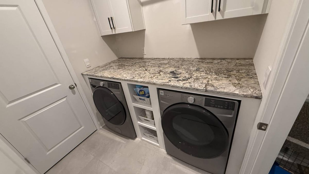close-up of custom laundry cabinetry and appliances in Troutman, NC by Carolina Signature Custom Homes-optimized