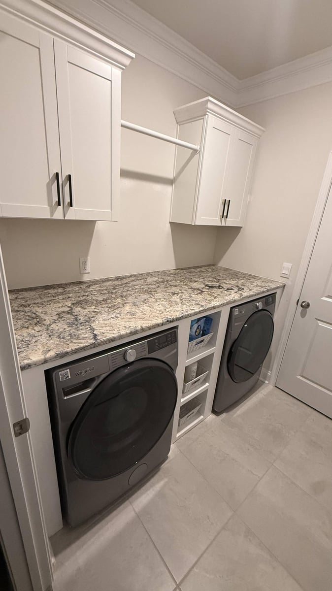 elegant laundry room design with storage cabinets in Troutman, NC by Carolina Signature Custom Homes-optimized