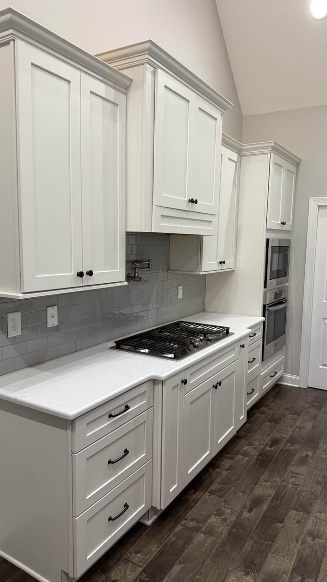 modern kitchen remodel with white cabinets and subway tile backsplash in Mt Ulla NC by Carolina Signature Custom Homes-optimized