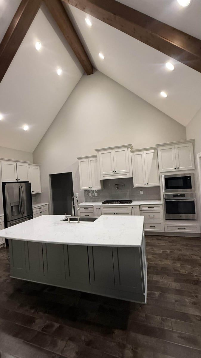 modern kitchen with exposed beams and white cabinetry in Mt Ulla NC by Carolina Signature Custom Homes-optimized