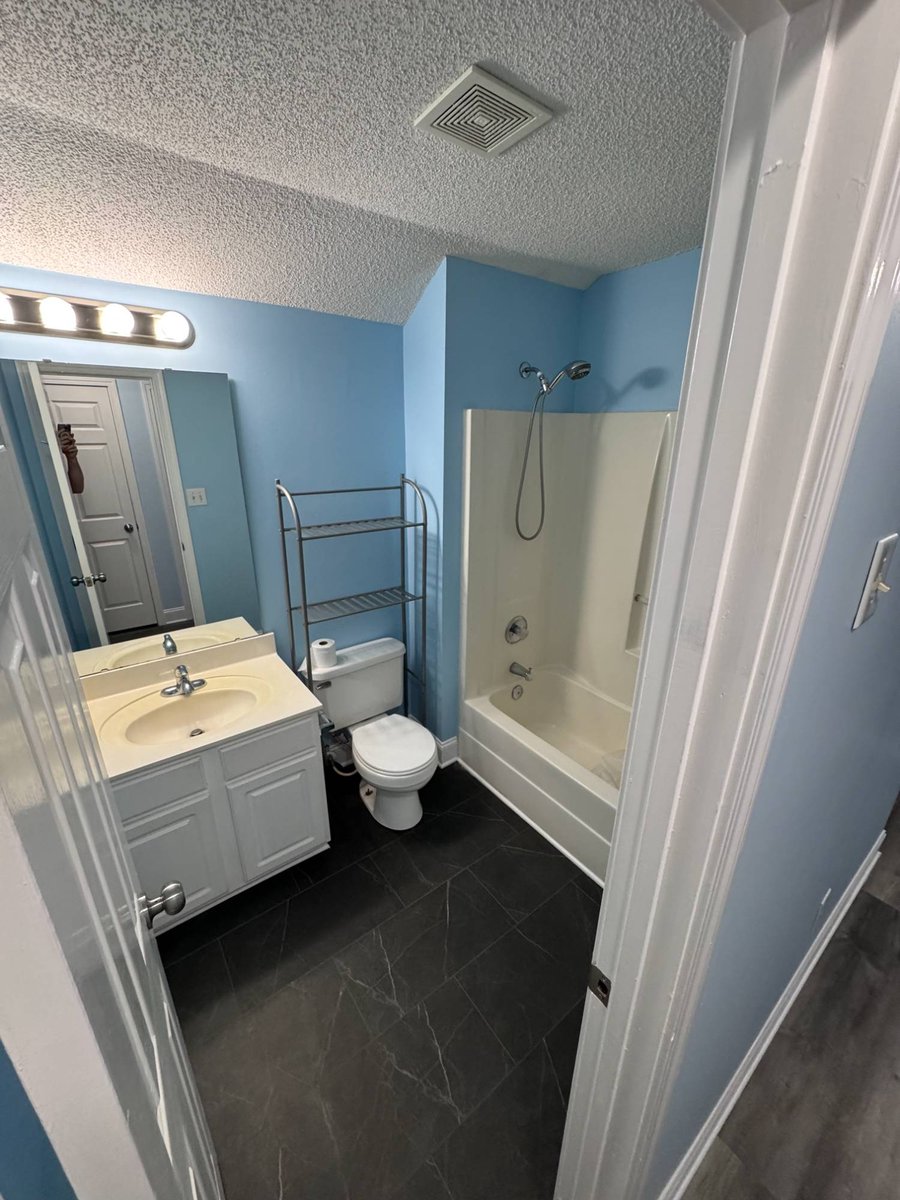 bathroom before remodel showing tub and single sink vanity by Carolina Signature Custom Homes in Aitken Charlotte NC-optimized