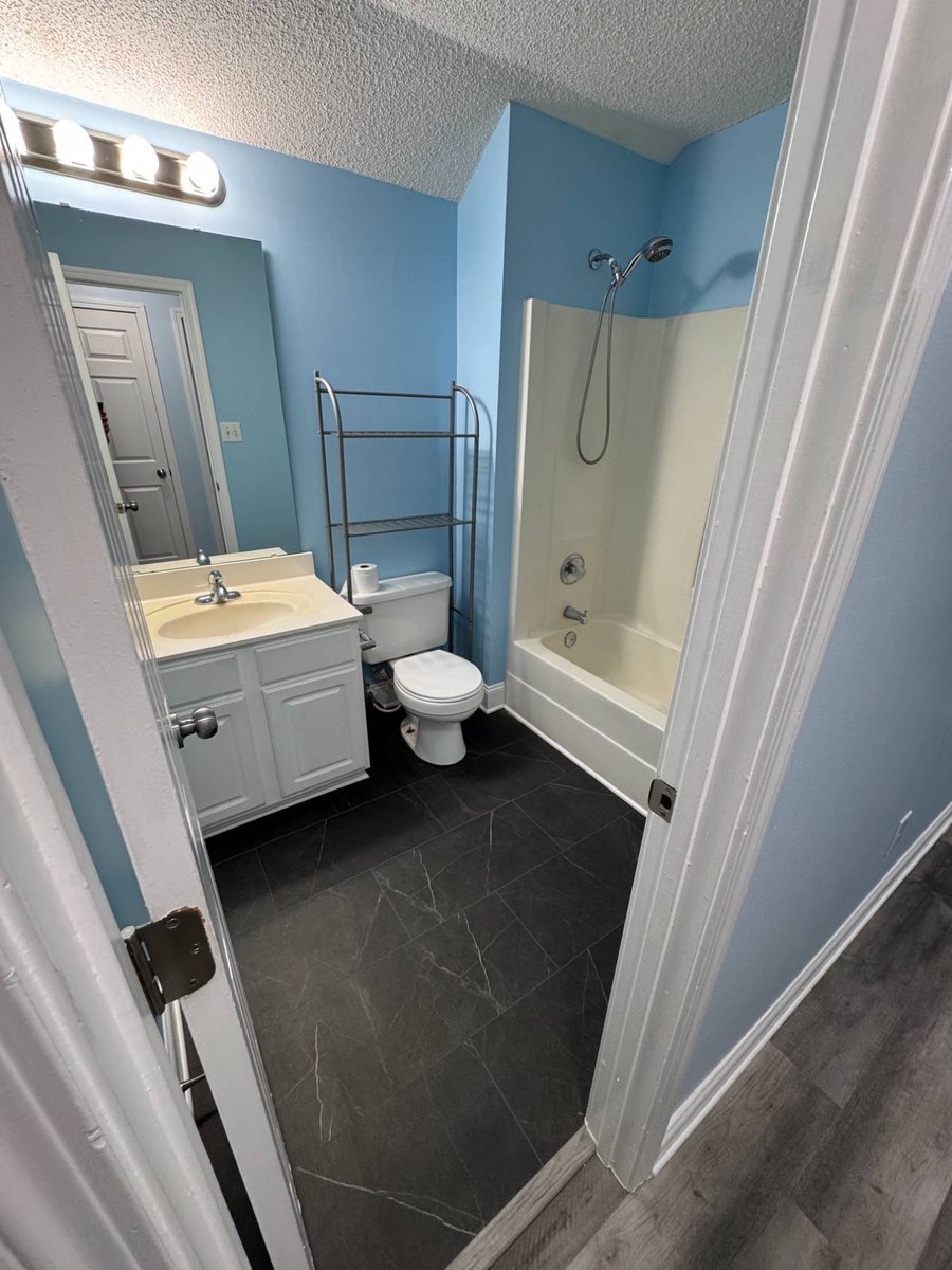 bathroom remodel before with tub shower combo and basic vanity by Carolina Signature Custom Homes in Aitken Charlotte NC-optimized