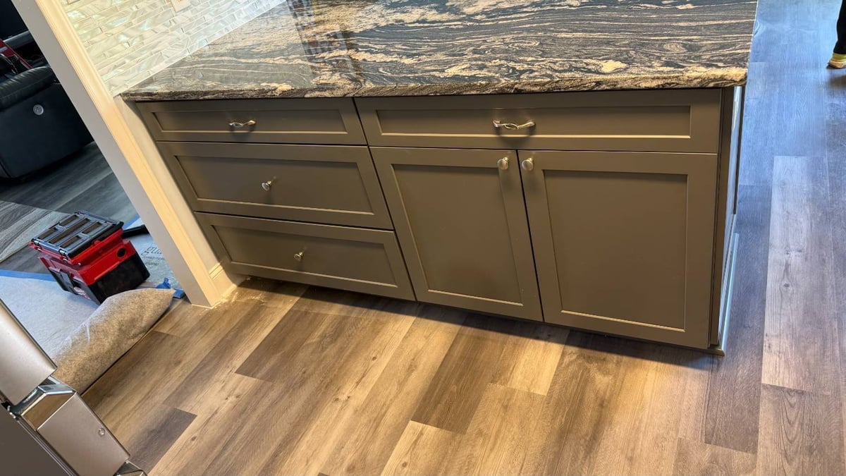close up of kitchen island with storage and new flooring by Carolina Signature Custom Homes in Aitken Charlotte NC-optimized