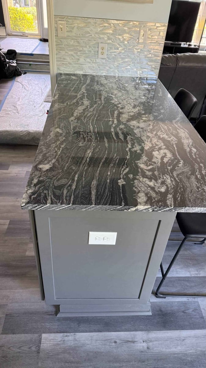 custom kitchen island with granite countertop and glass tile backsplash by Carolina Signature Custom Homes in Aitken Charlotte N-optimized