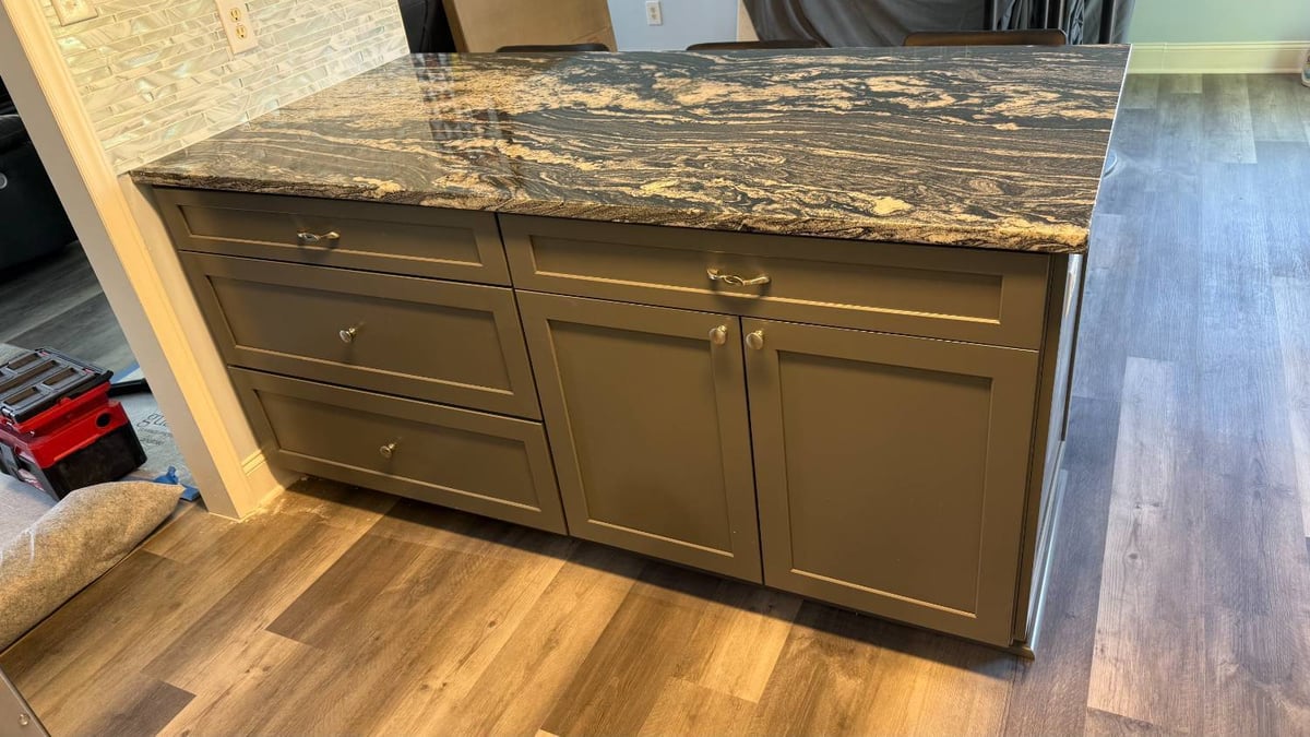 kitchen remodel detail showing island cabinets and vinyl flooring by Carolina Signature Custom Homes in Aitken Charlotte NC-optimized