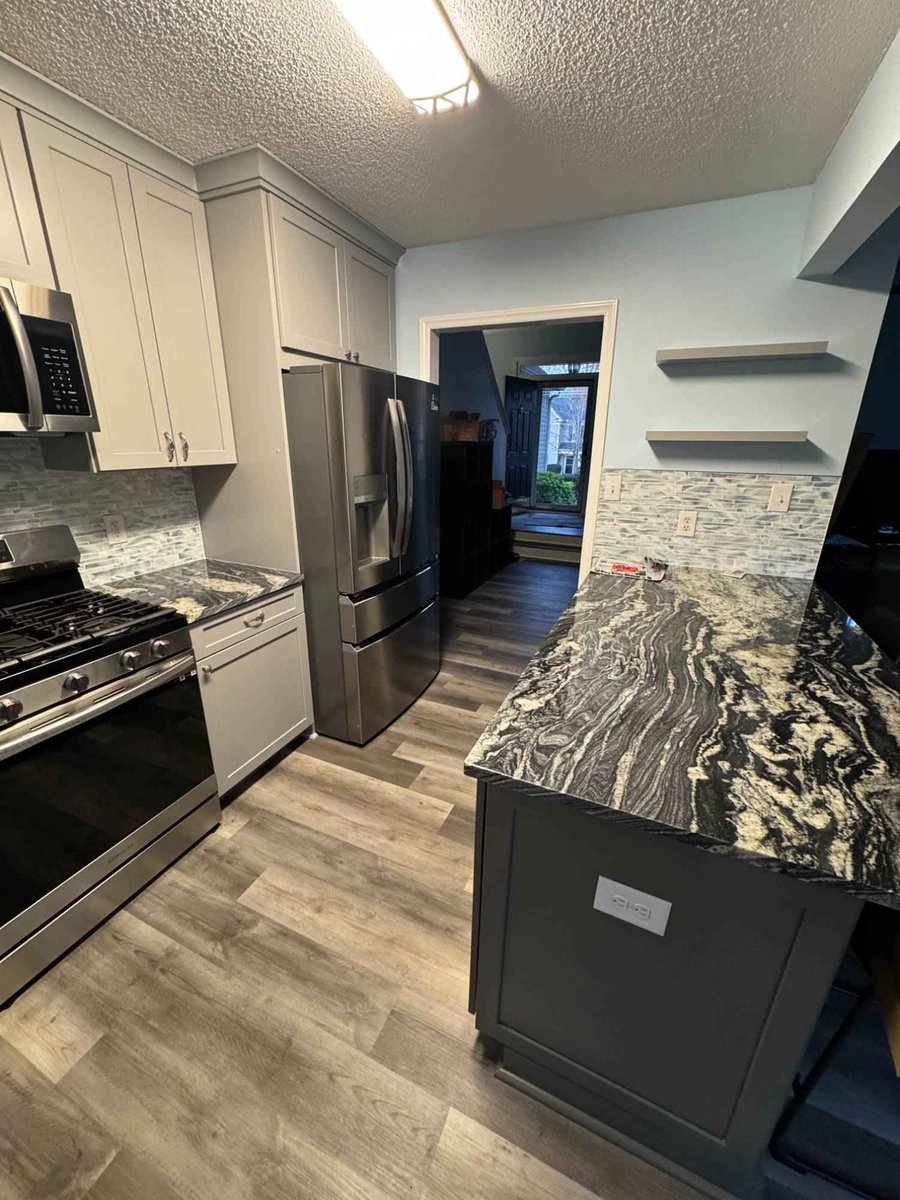 kitchen remodel with granite island and updated cabinets by Carolina Signature Custom Homes in Aitken Charlotte NC-optimized-optimized