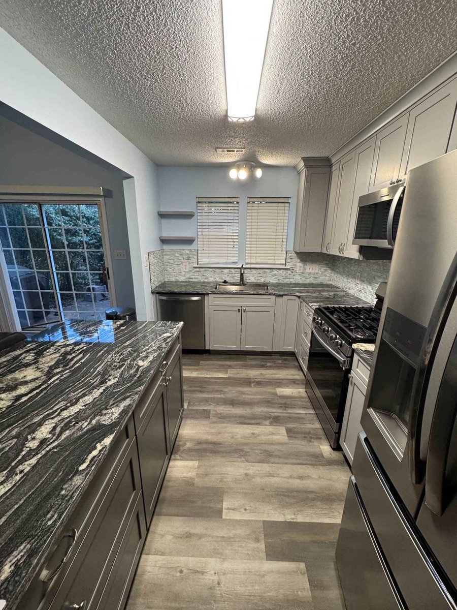 kitchen remodel with island seating and stainless appliances by Carolina Signature Custom Homes in Aitken Charlotte NC-optimized-optimized