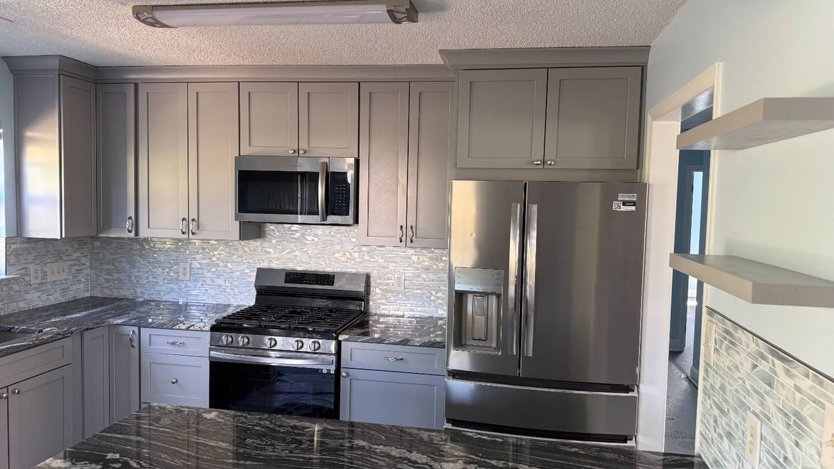 kitchen remodel with stainless appliances and gray cabinets by Carolina Signature Custom Homes in Aitken Charlotte NC-optimized