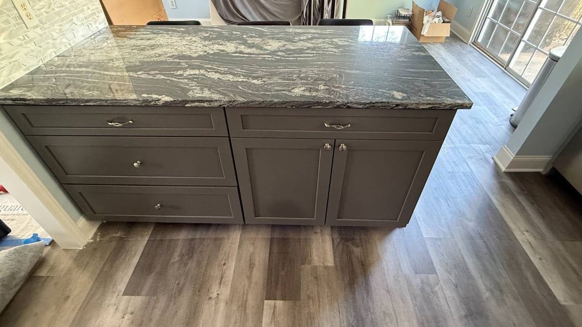 modern kitchen island with stone countertop and gray cabinets installed in Aitken Charlotte NC by Carolina Signature Custom Home-optimized