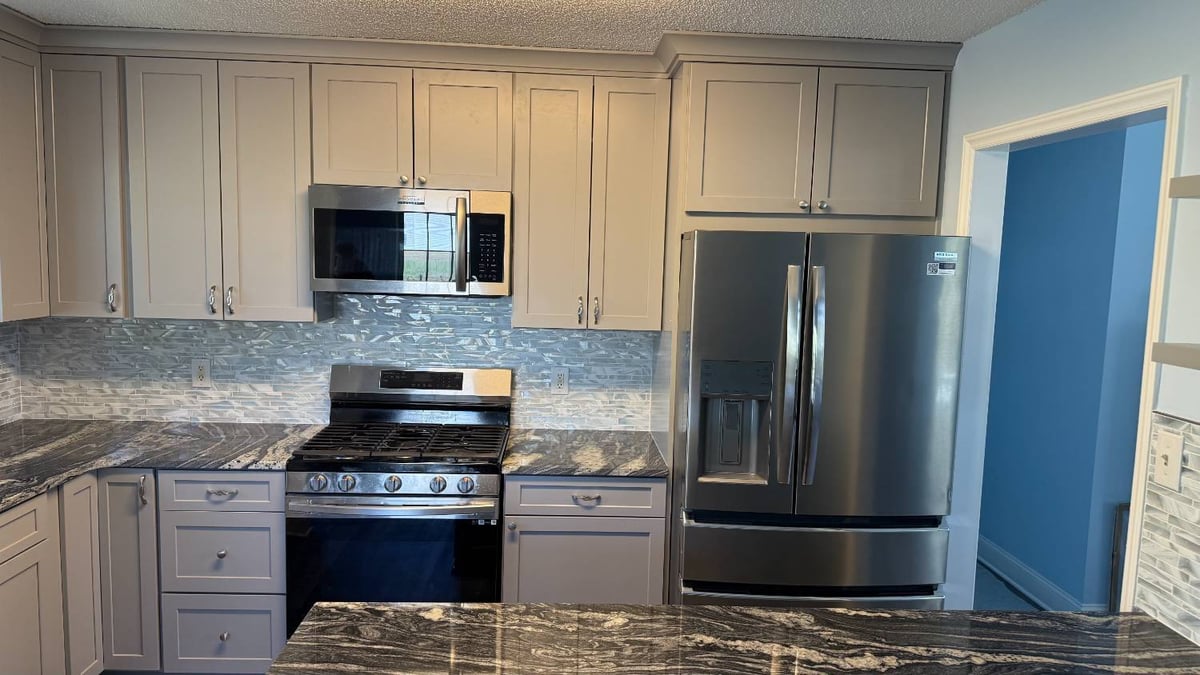 modern kitchen renovation with stainless steel appliances by Carolina Signature Custom Homes in Aitken Charlotte NC-optimized