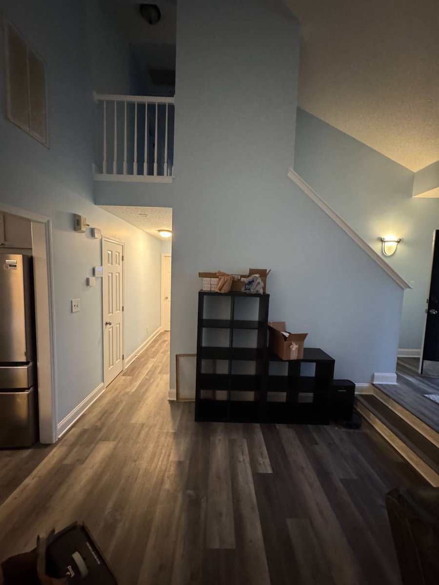 open living area with new flooring and stairway remodel by Carolina Signature Custom Homes in Aitken Charlotte NC-optimized