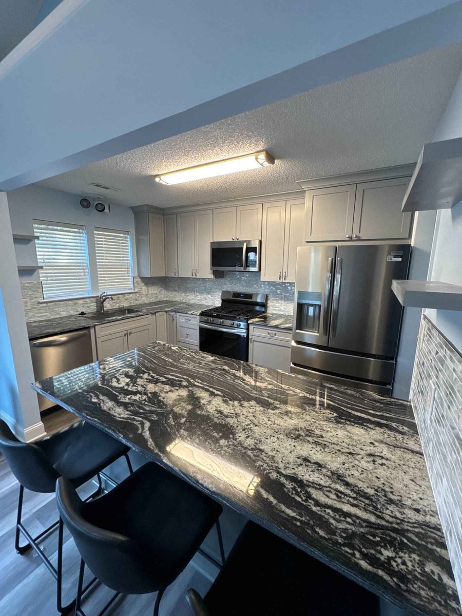 updated kitchen renovation with gray cabinets and stone countertops by Carolina Signature Custom Homes in Aitken Charlotte NC-op-optimized