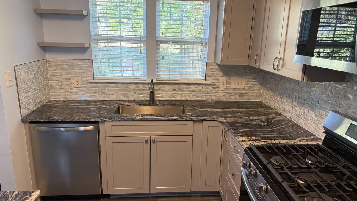 updated kitchen with modern backsplash and granite countertops by Carolina Signature Custom Homes in Aitken Charlotte NC-optimized