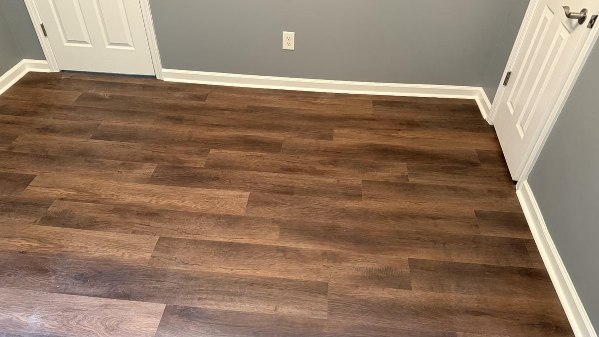 close-up of installed wood flooring with rich tones in Mooresville NC by Carolina Signature Custom Homes-optimized
