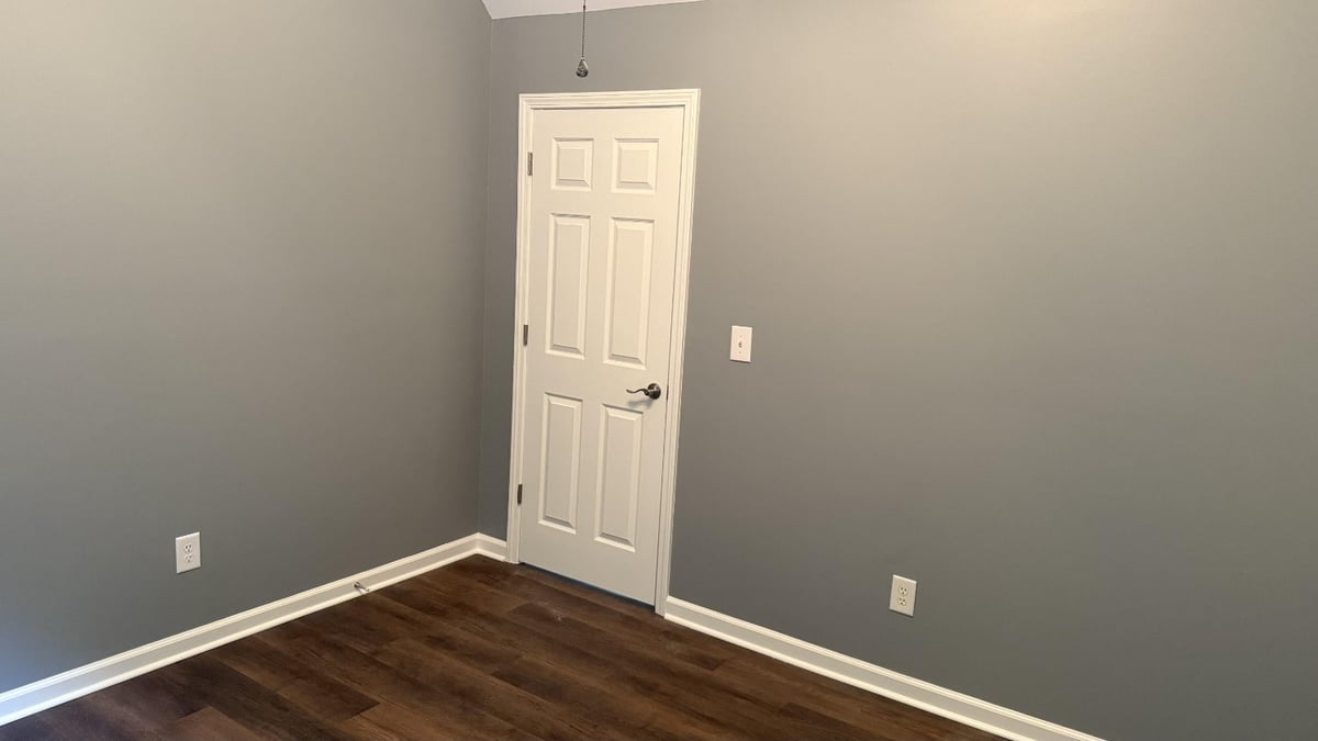 interior bedroom showcasing upgraded flooring in Mooresville NC by Carolina Signature Custom Homes-optimized