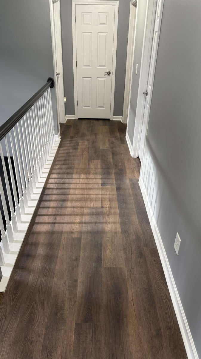 upgraded hallway flooring with natural wood tones in Mooresville NC by Carolina Signature Custom Homes-optimized