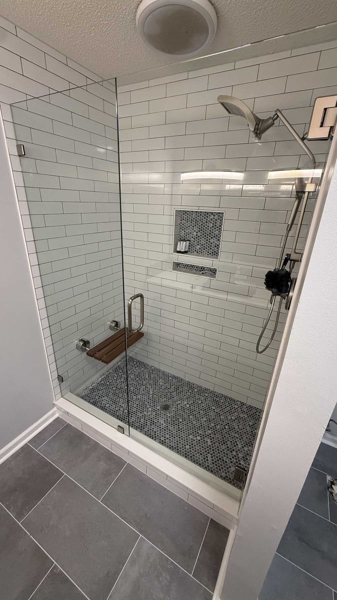 new custom shower installation with subway tile walls and niche in Mooresville, NC by Carolina Signature Custom Homes-optimized