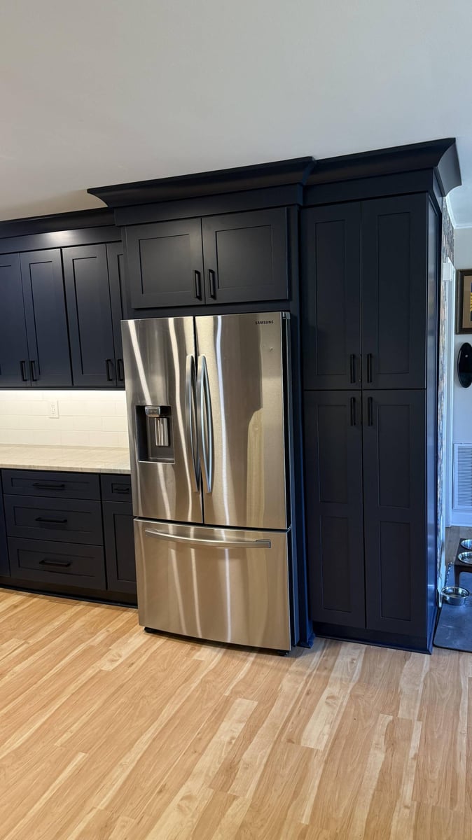 New kitchen remodel by Carolina Signature Custom Homes in Higgins, NC featuring dark shaker cabinets and stainless steel refrige-optimized