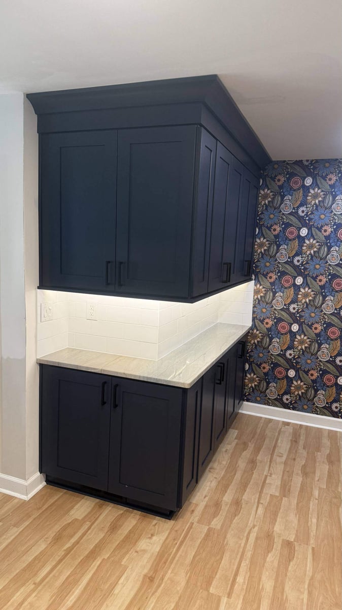 built-in kitchen cabinetry with modern finishes and accent wall in Higgins, NC by Carolina Signature Custom Homes-optimized-optimized