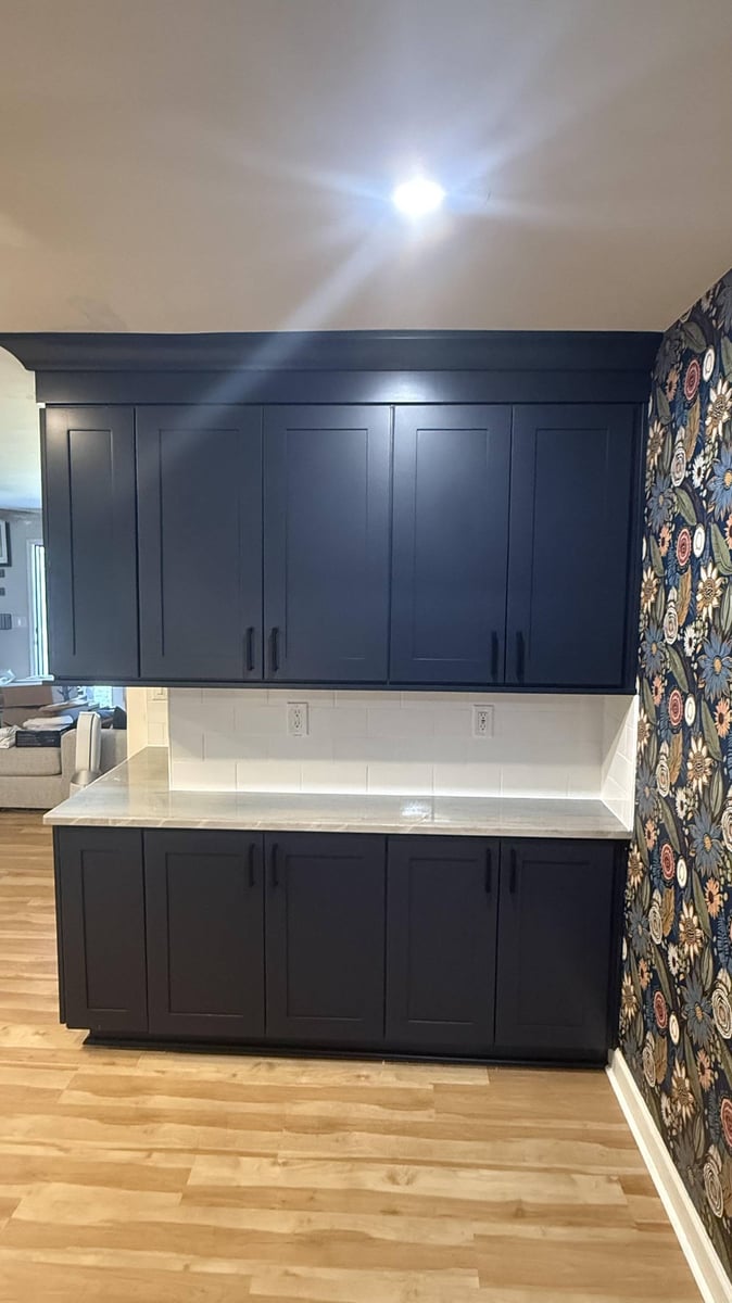 custom kitchen design with dark cabinetry and quartz countertops in Higgins, NC by Carolina Signature Custom Homes-optimized