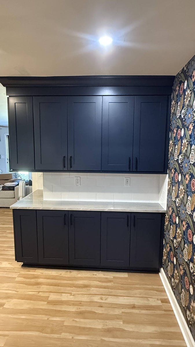 modern kitchen cabinets with backsplash and accent wall in Higgins, NC by Carolina Signature Custom Homes-optimized