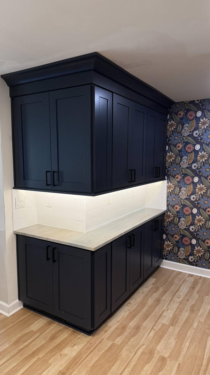 modern kitchen cabinets with built-in storage and backsplash in Higgins, NC by Carolina Signature Custom Homes-optimized