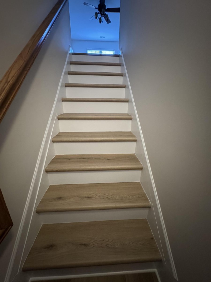 interior stair renovation showcasing new treads and trim in Cornelius NC by Carolina Signature Custom Homes-optimized