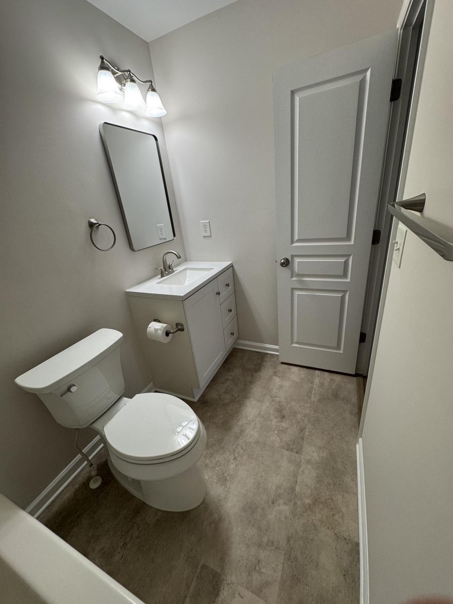 modern bathroom renovation featuring fresh paint and new floors in Cornelius NC by Carolina Signature Custom Homes-optimized