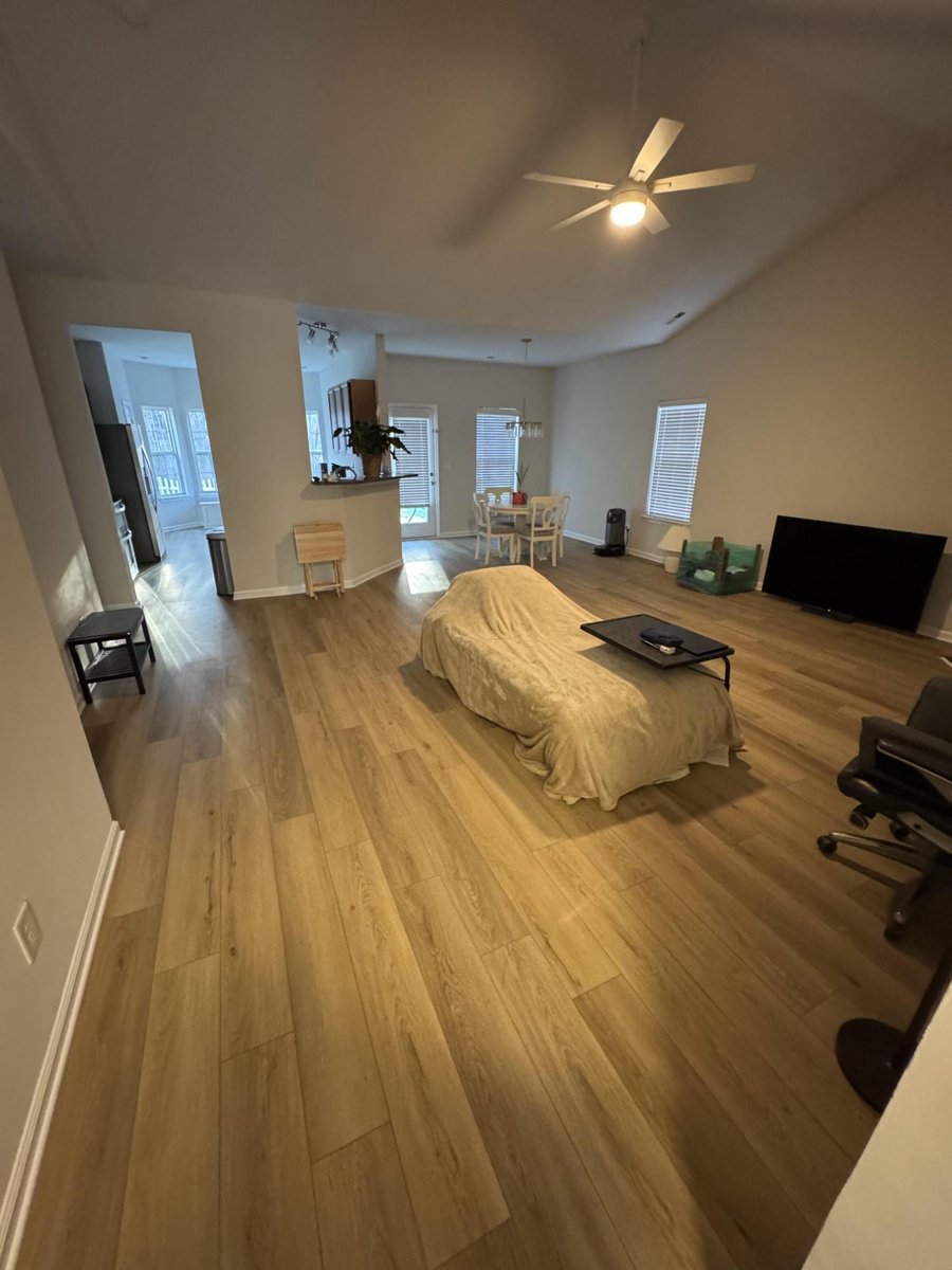 open living room with new flooring, paint, and trim by Carolina Signature Custom Homes in Cornelius, NC-optimized