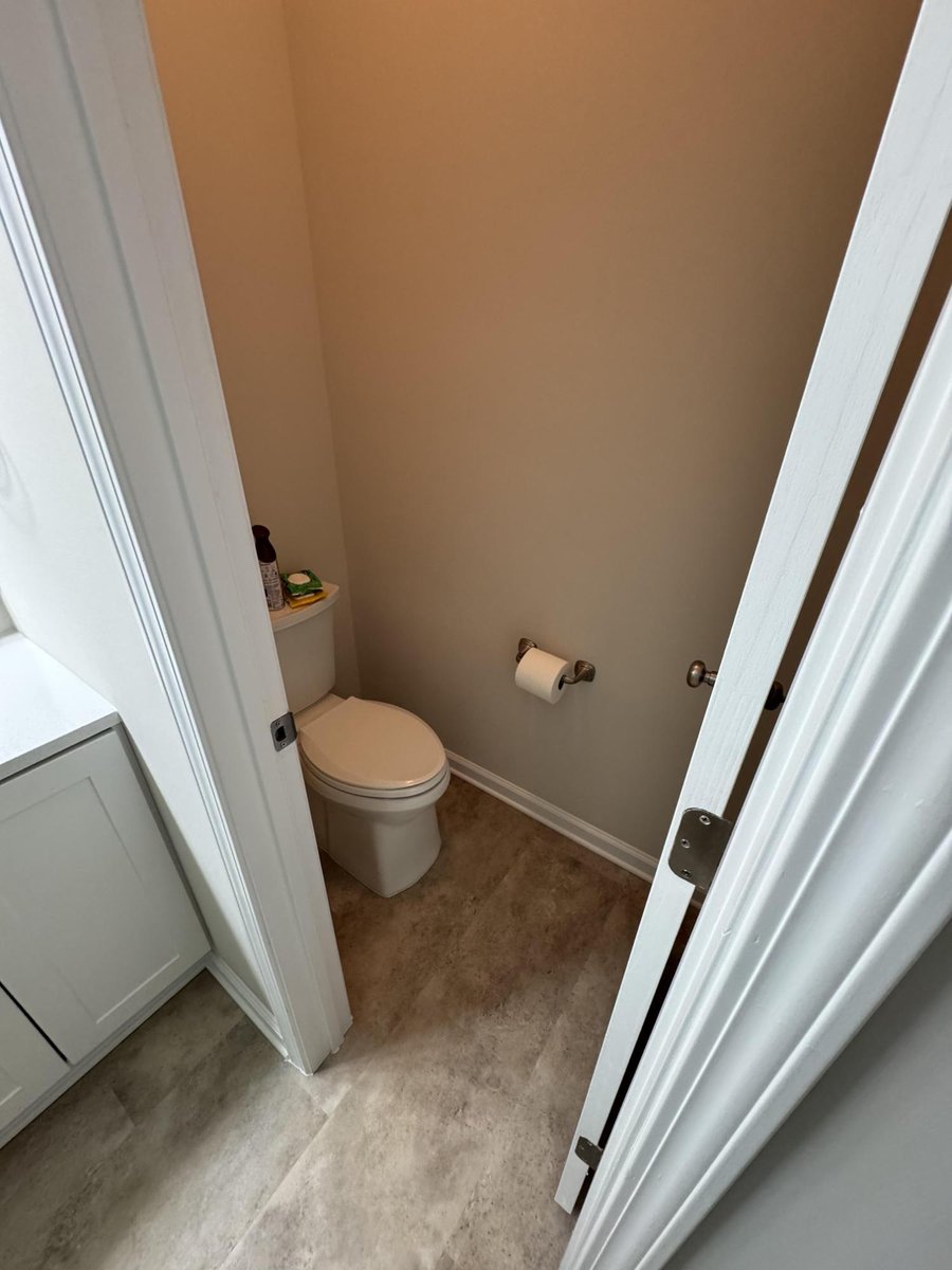 small bathroom renovation featuring new floors and trim by Carolina Signature Custom Homes in Cornelius NC-optimized