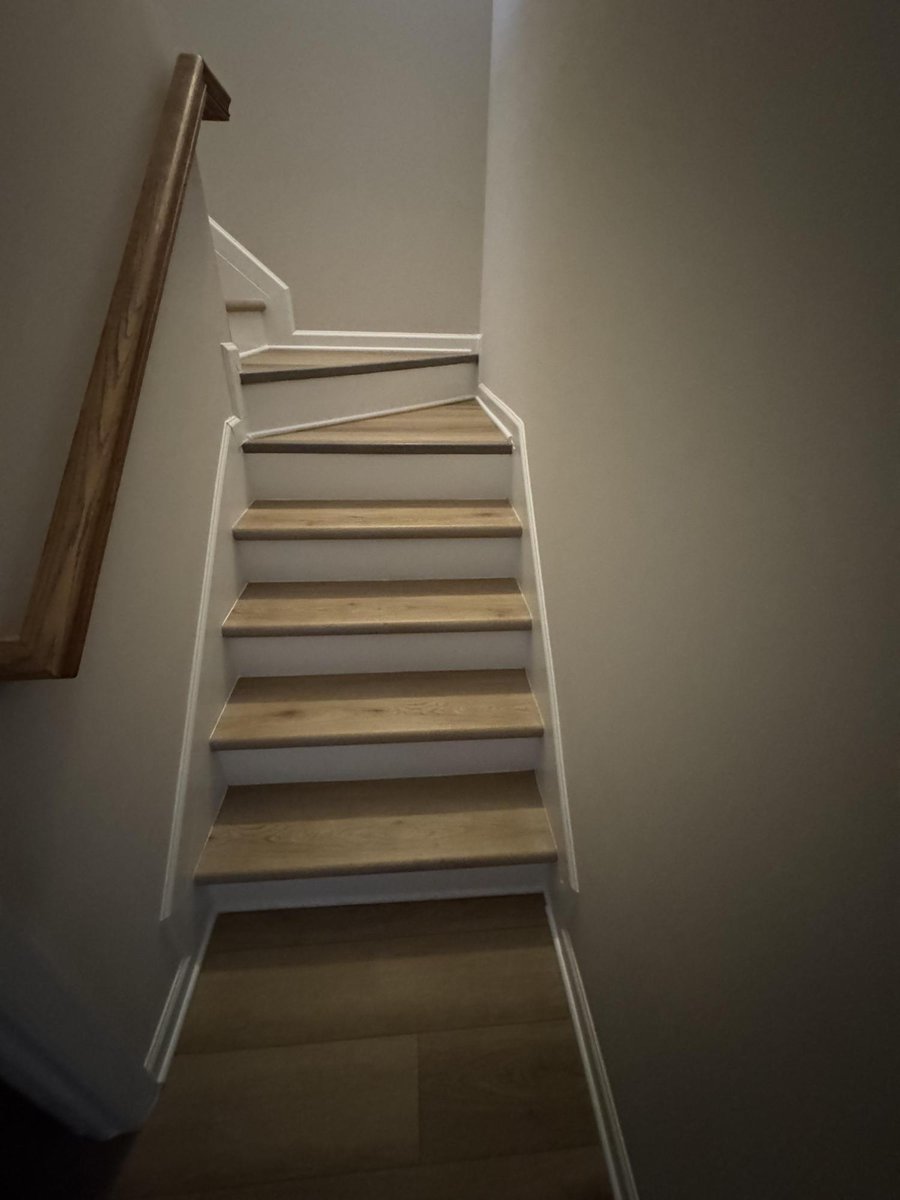 stairway renovation featuring new treads and trim by Carolina Signature Custom Homes in Cornelius NC-optimized