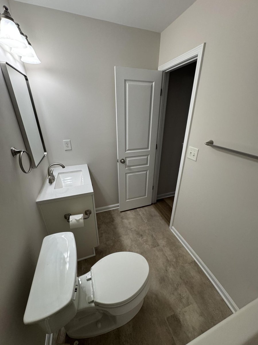 updated bathroom with modern flooring and fresh paint by Carolina Signature Custom Homes in Cornelius NC-optimized