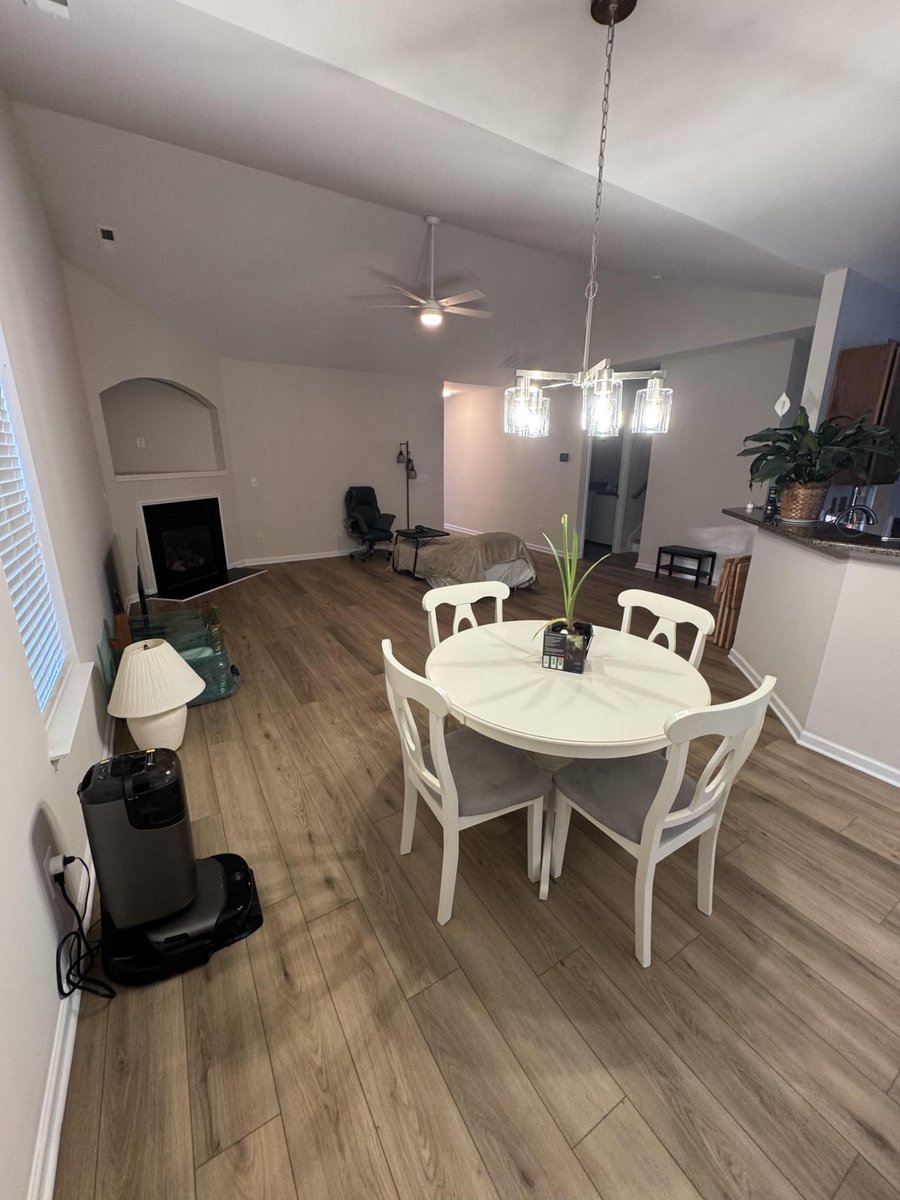 updated dining room featuring modern floors, fresh paint, and trim by Carolina Signature Custom Homes in Cornelius, NC-optimized