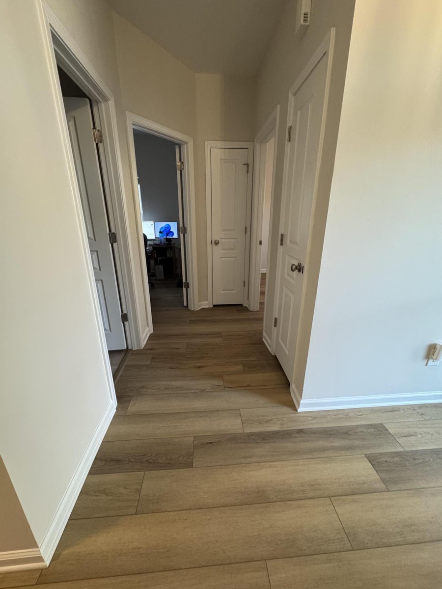 updated hallway with wood-look flooring and fresh trim by Carolina Signature Custom Homes in Cornelius NC-optimized