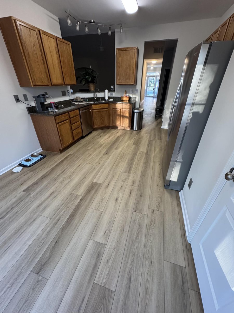 updated kitchen interior with modern flooring, fresh paint, and trim by Carolina Signature Custom Homes in Cornelius, NC-optimized