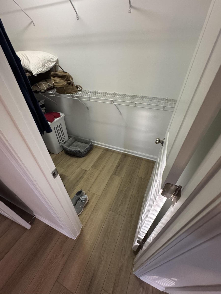 walk-in closet with updated flooring and fresh paint by Carolina Signature Custom Homes in Cornelius NC-optimized