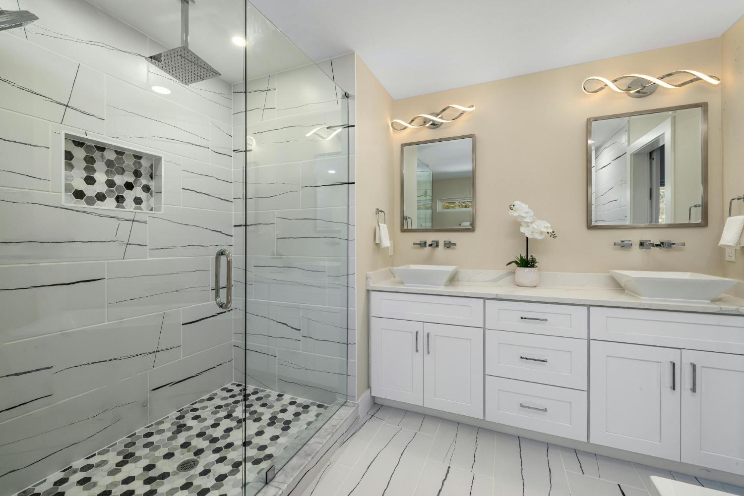 bright bathroom with glass shower and modern vanity in Troutman NC by Carolina Signature Custom Homes stock-optimized