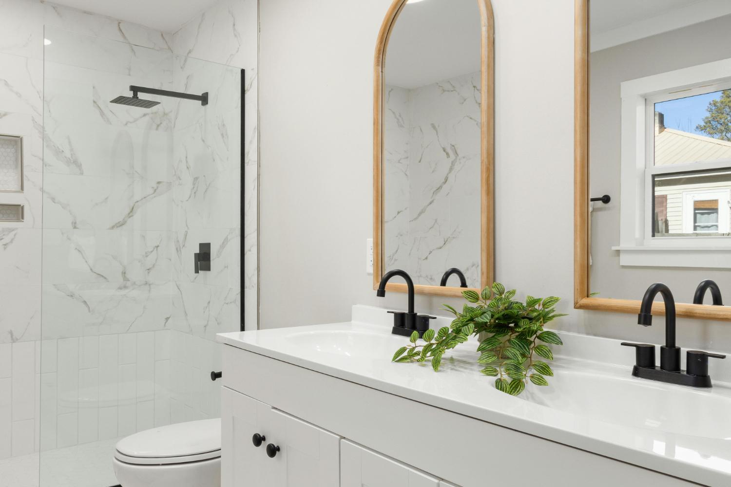 custom bathroom design with marble shower and modern fixtures in Troutman, NC by Carolina Signature Custom Homes stock-optimized