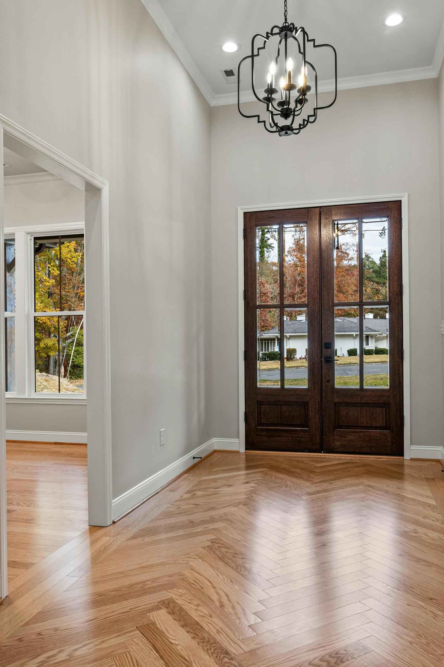 entryway with herringbone wood flooring and tall ceilings in Troutman NC by Carolina Signature Custom Homes stock-optimized-optimized