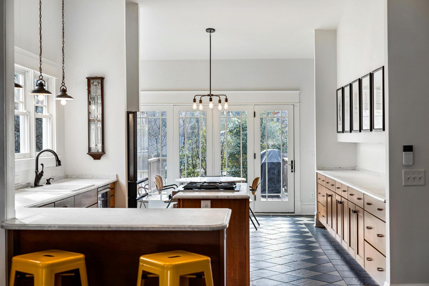 open concept kitchen remodel with island and dining area by Carolina Signature Custom Homes Troutman NC stock-optimized