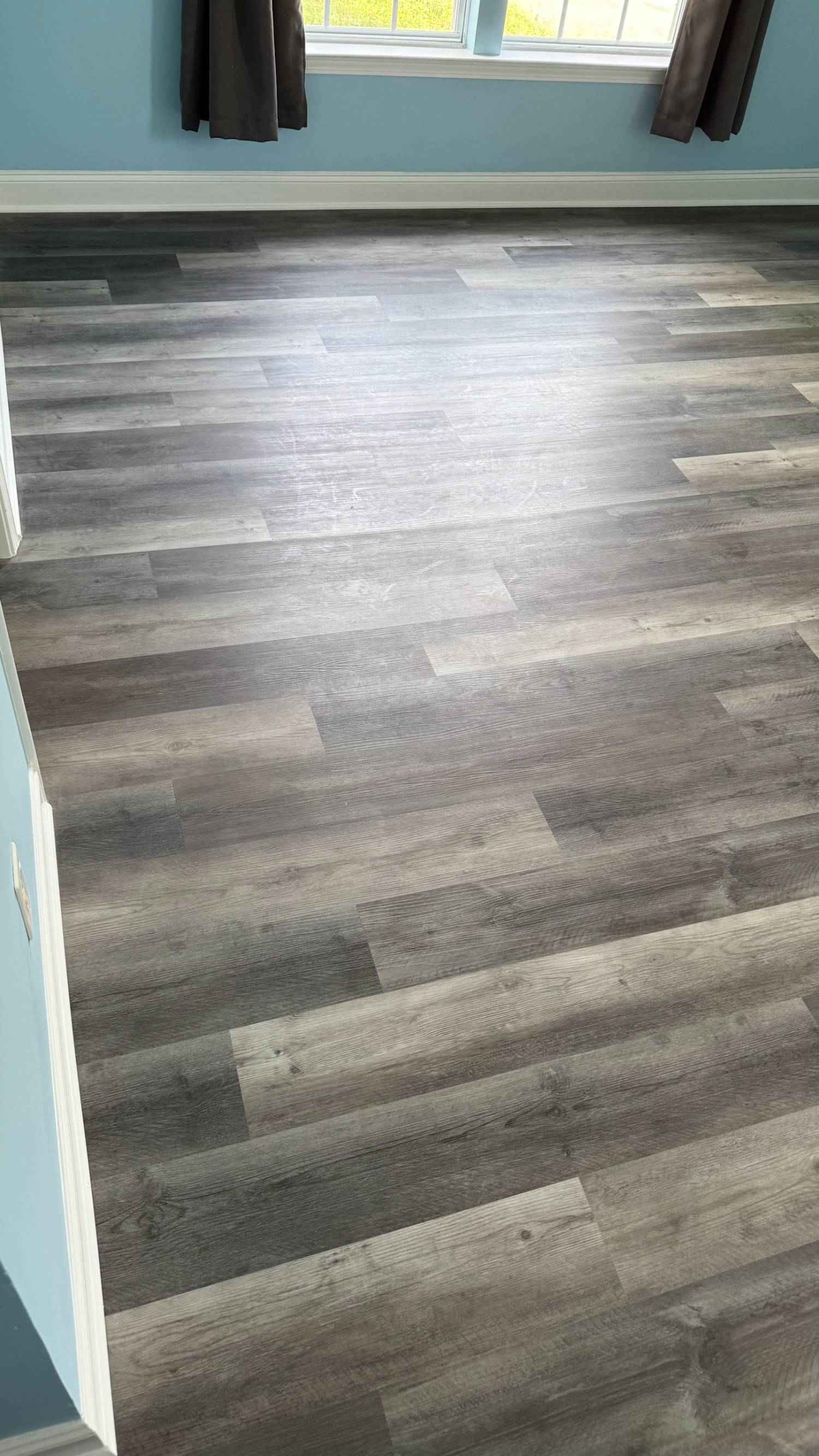 new flooring installation with wood-look vinyl planks in Aitken Charlotte NC by Carolina Signature Custom Homes-optimized-optimized