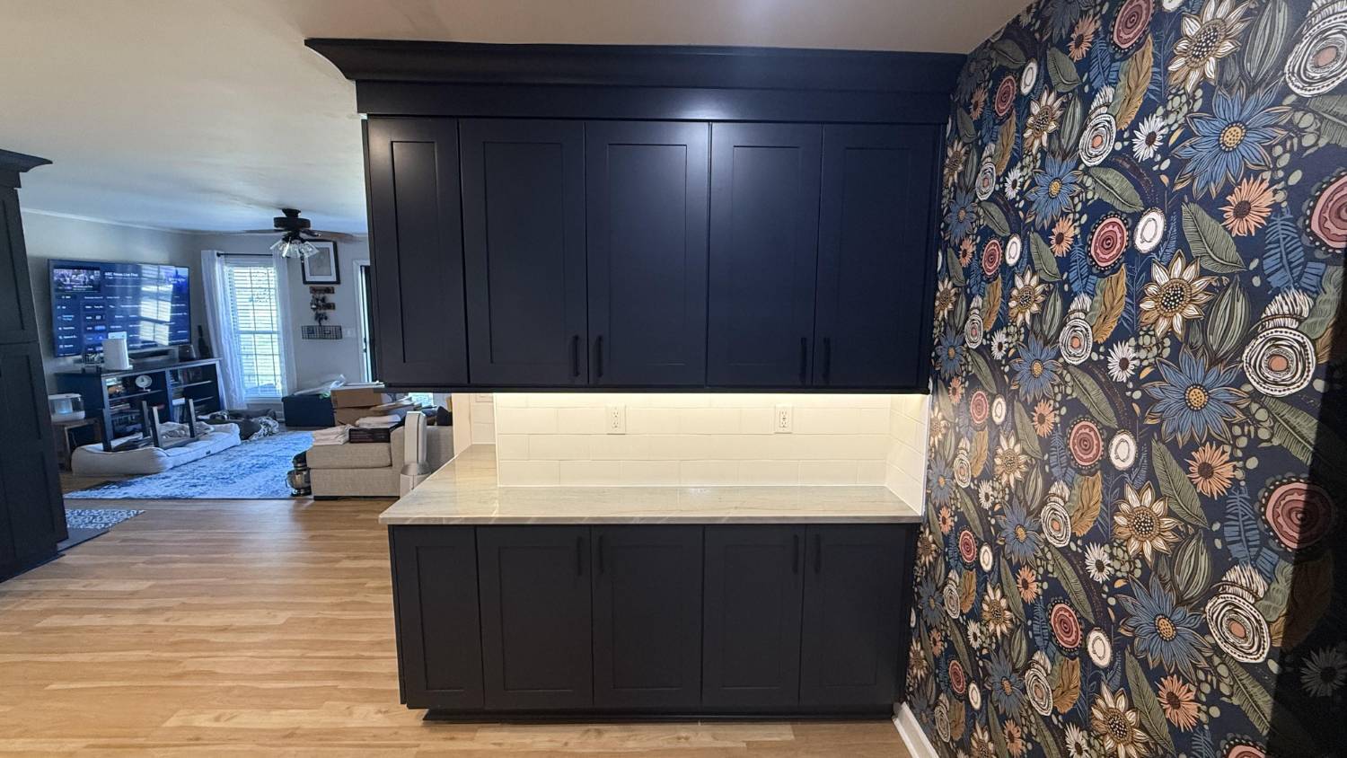 custom kitchen storage cabinets with quartz countertops and accent wall in Higgins, NC by Carolina Signature Custom Homes